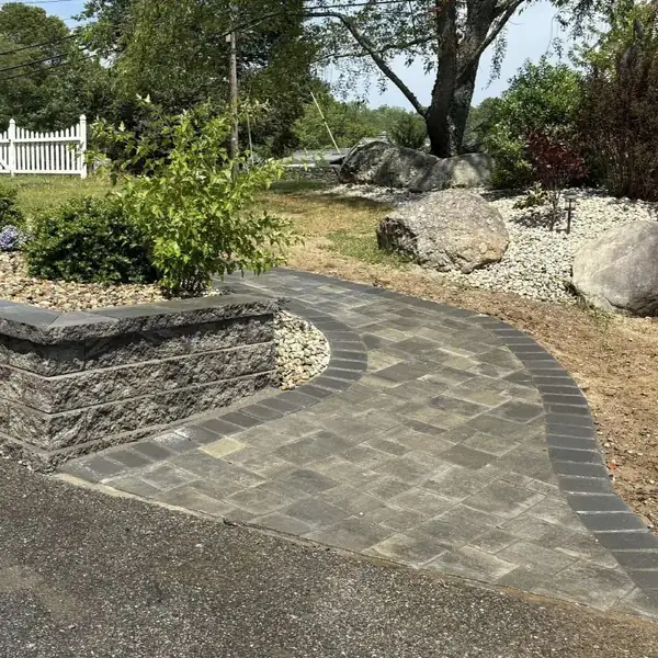 Block retaining wall and paver walkway