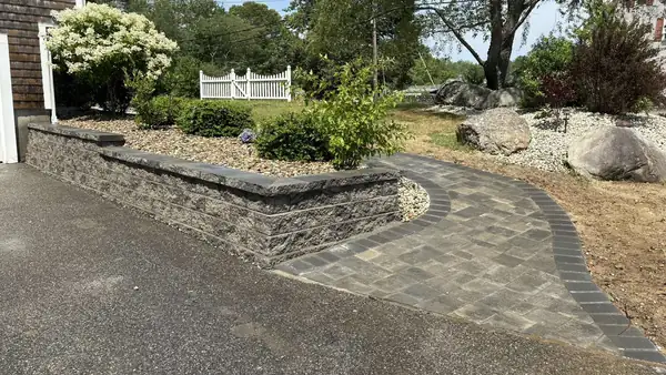 Block retaining wall and paver walkway